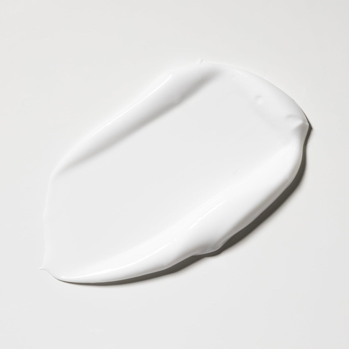 Dionis 20 fl oz pouch next to a standard lotion bottle highlighting refill quantity advantage