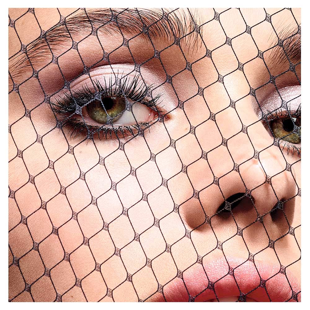 Dior model wearing mascara for dramatic wide-eyed effect