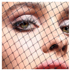 Dior model wearing mascara for dramatic wide-eyed effect