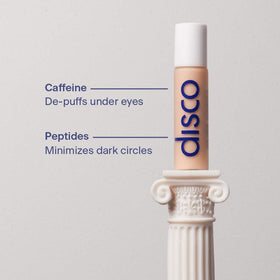 Disco stick held in hand showing 10mL compact size and portability