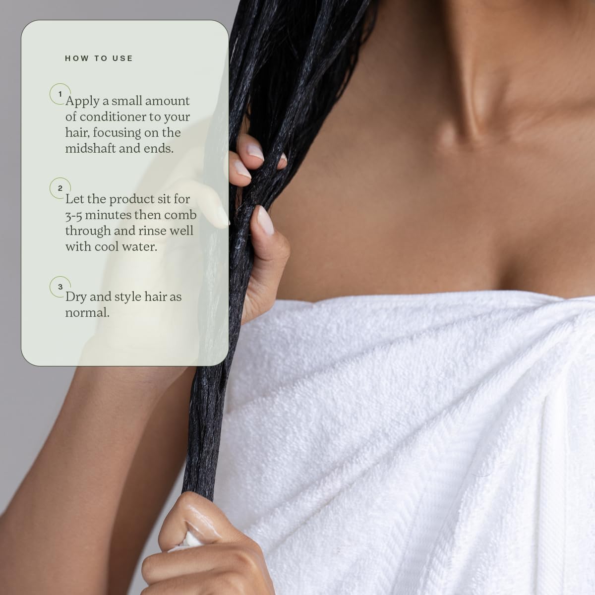 Divi bottle in hand to show 12 fl oz scale and travel convenience