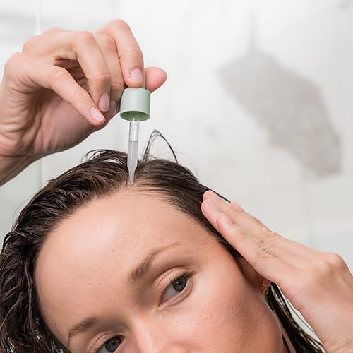 divi scalp serum on bathroom shelf lifestyle scene suggesting routine-ready product