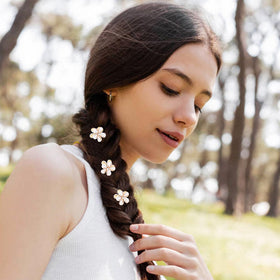 Dizila lifestyle shot of child wearing floral clips for playful charm