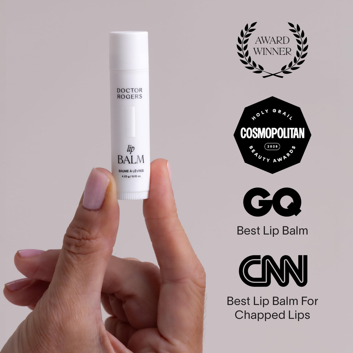 Doctor Rogers Restore lip balm in hand to show pocket-sized convenience and portability