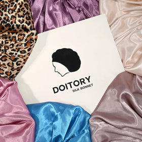 Doitory worn over braids showing protection and reduced tangling for styled hair