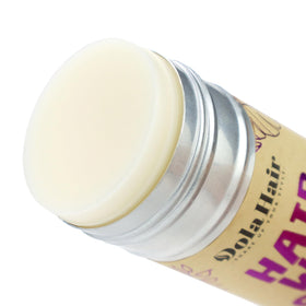 Product label on Dolahair stick displaying safe ingredients and usage info