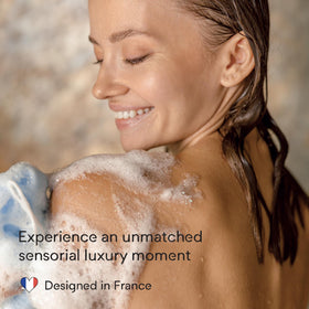Doliderm bottle staged in bathroom conveying warm ritual and comfort