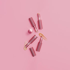 DOLL 10 balm stick applied under-eye demonstrating de-puffing and smoothing