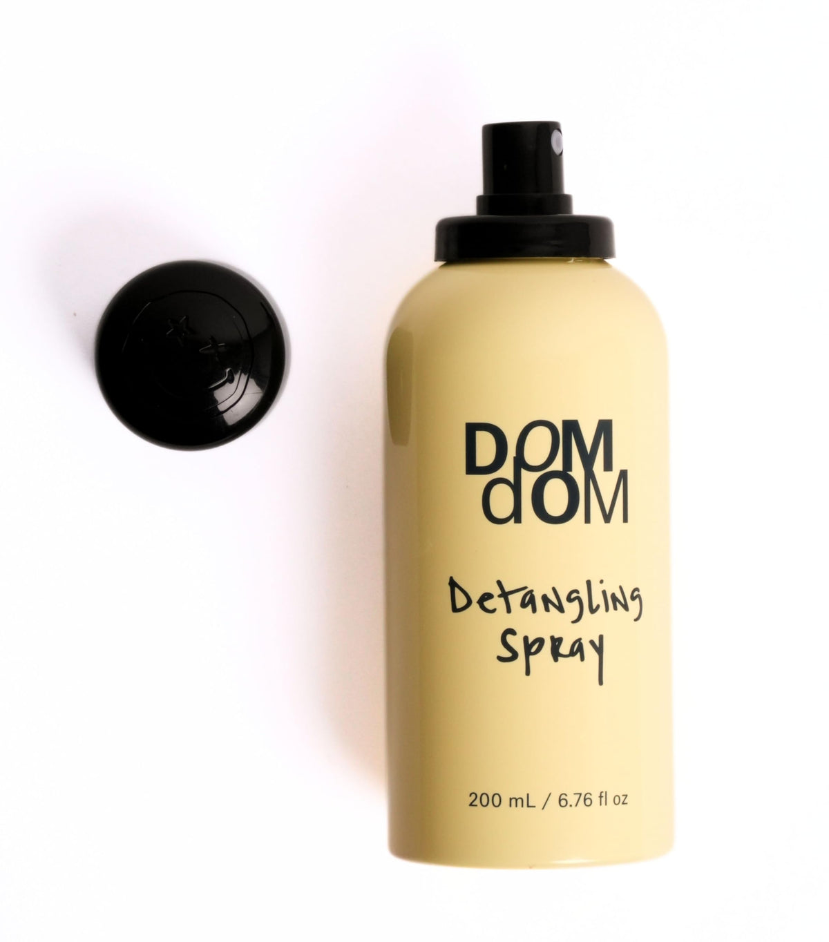 Dom Dom held over bathroom sink illustrating ease of use and quick styling prep