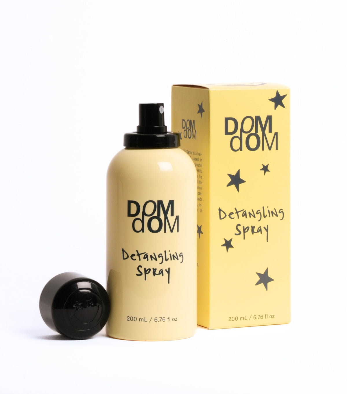 Dom Dom spray mist close-up demonstrating fine dispersion for gentle detangling