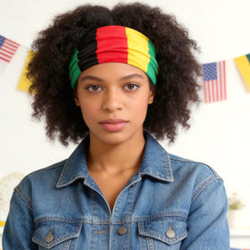 Doneace headband worn turban-style on a woman at an outdoor event, expressive look