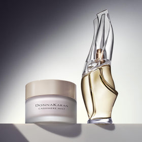 Donna Karan Cashmere Mist applied to hand illustrating soft hydrated skin benefit