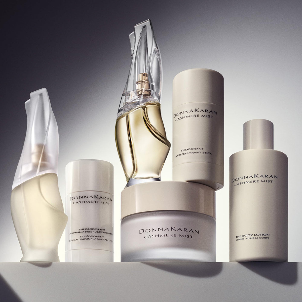 Donna Karan Cashmere Mist next to everyday items for clear size and scale