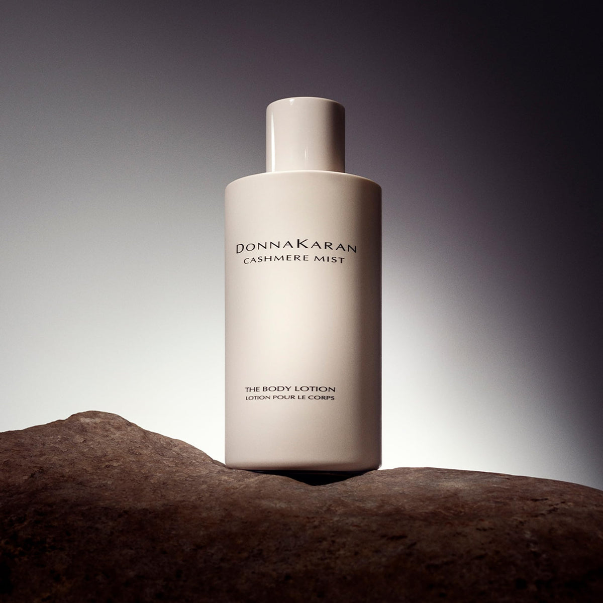 Donna Karan Cashmere Mist texture swipe showing creamy lotion for instant hydration