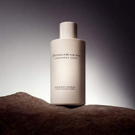 Donna Karan Cashmere Mist texture swipe showing creamy lotion for instant hydration