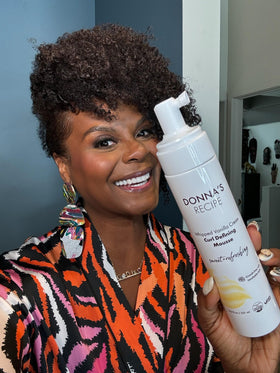 Donna's Recipe styled curls in lifestyle setting showcasing frizz control