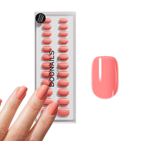 DOONAILS front packaging showing short square pink nails and kit benefits