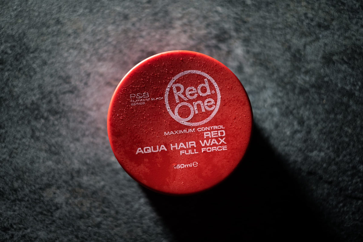 Dorzu Red One beside a coin for scale showing 150ml tub size benefits