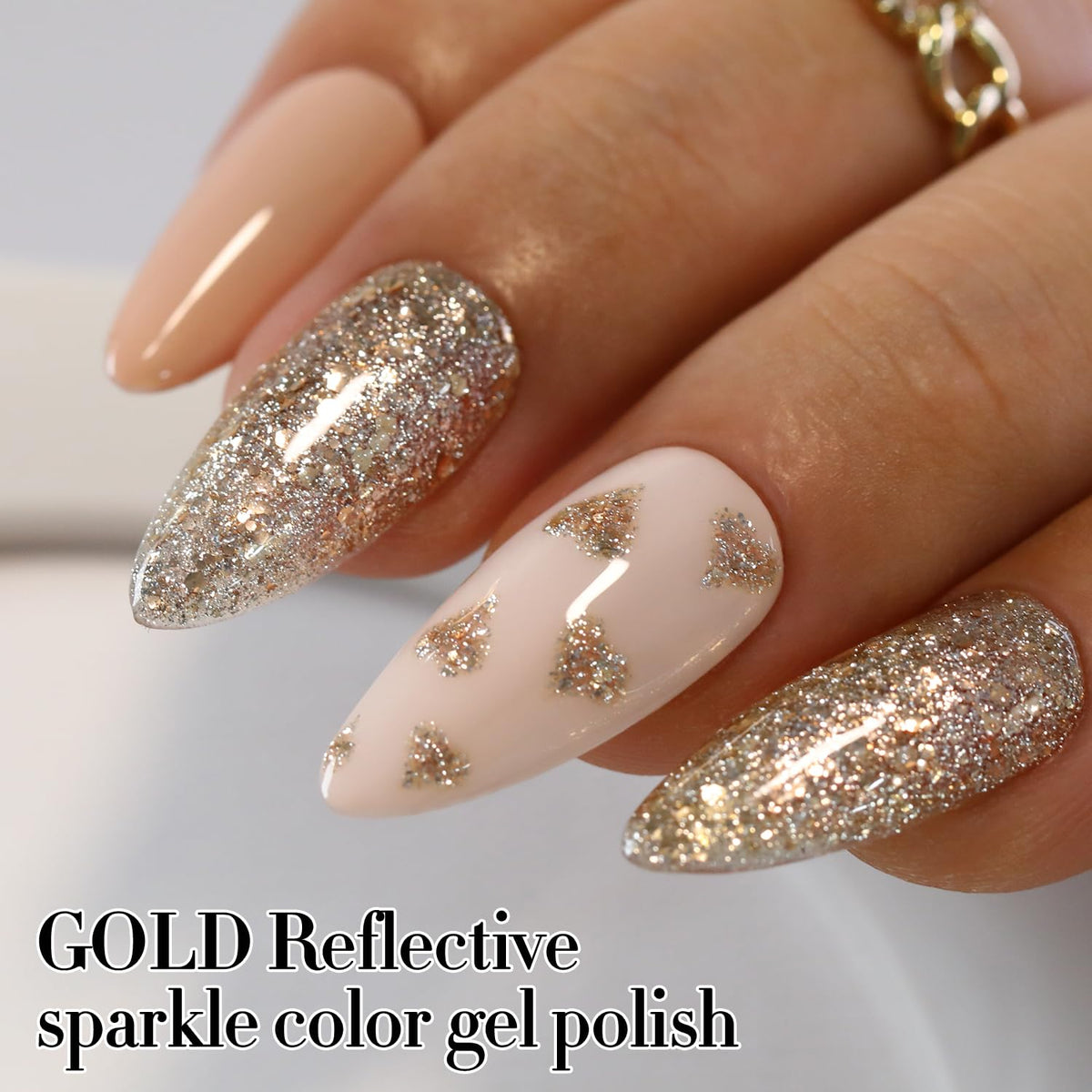 Double Rhythm hand model wearing gold and silver nails for stylish look