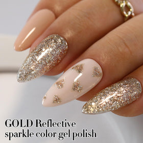 Double Rhythm hand model wearing gold and silver nails for stylish look