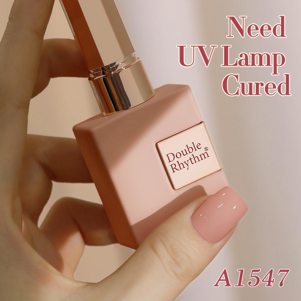 Double Rhythm hand holding bottle for scale showing 15ml size benefit multiple uses