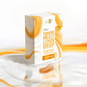 Dove bar beside turmeric and lemon showing plant-based ingredient benefits
