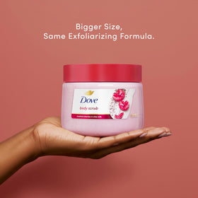 Dove applying scrub in hand demonstrating ease of use and moisturizing benefit
