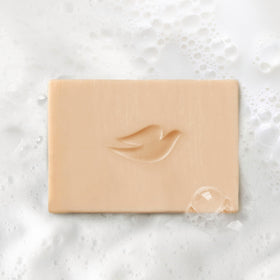 Coconut milk pouring over a bar to highlight plant-based milk hydration benefit