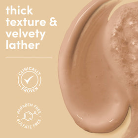 Close-up of creamy serum texture from Dove, showing rich lather and moisturizing look