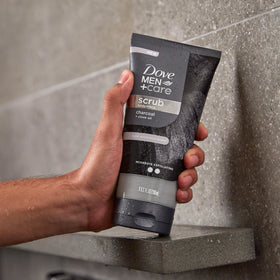 DOVE MEN + CARE next to a ruler for 9 oz size clarity and portability benefit