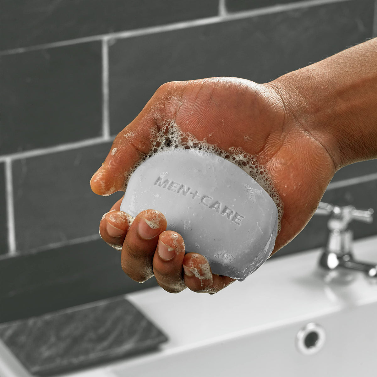 DOVE MEN + CARE close-up of bar texture highlighting moisturizing cream