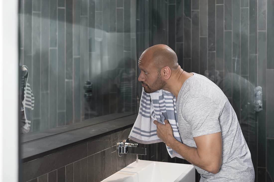 DOVE MEN + CARE on bathroom shelf presenting everyday grooming routine