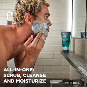 Dove Men+Care scrub lathering on hand to gently exfoliate and cleanse