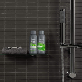 Dove Men+Care shampoo poured into hand illustrating lather and conditioning effect