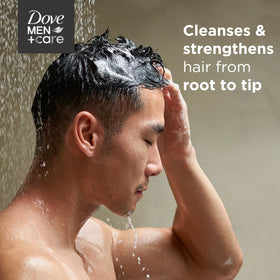 Dove Men+Care bottle beside grooming products in bathroom, supports complete routine