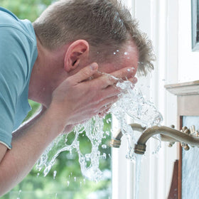 DOVE MEN + CARE application on damp hands demonstrating smooth spread