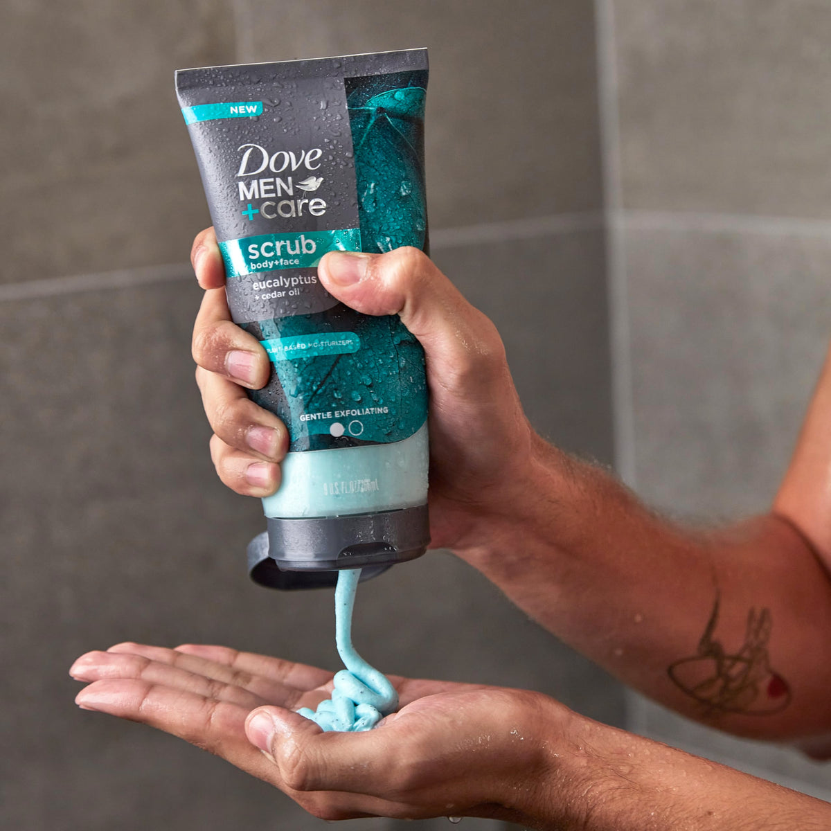 Dove Men+Care in-shower application on male model for effective exfoliation