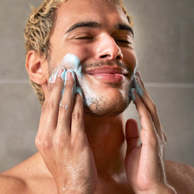 Dove Men+Care product pictured with eucalyptus leaves and cedar twigs