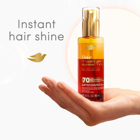 Dove serum being applied to damp hair for UV protection and shine
