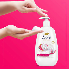 Dove bottle next to a hand for scale showing convenient daily size