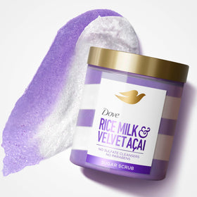 Open Dove tub with cream on spoon showing rich formula and easy scooping