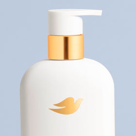Dove body wash in-shower use illustrating soothing application and comfort