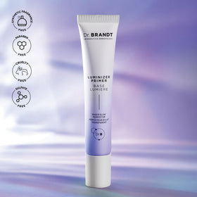 Dr. Brandt primer on vanity with brush and mirror conveying everyday glow prep