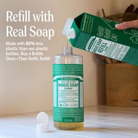 Dr. Bronner's almond being poured creating rich lather, quick effective cleaning