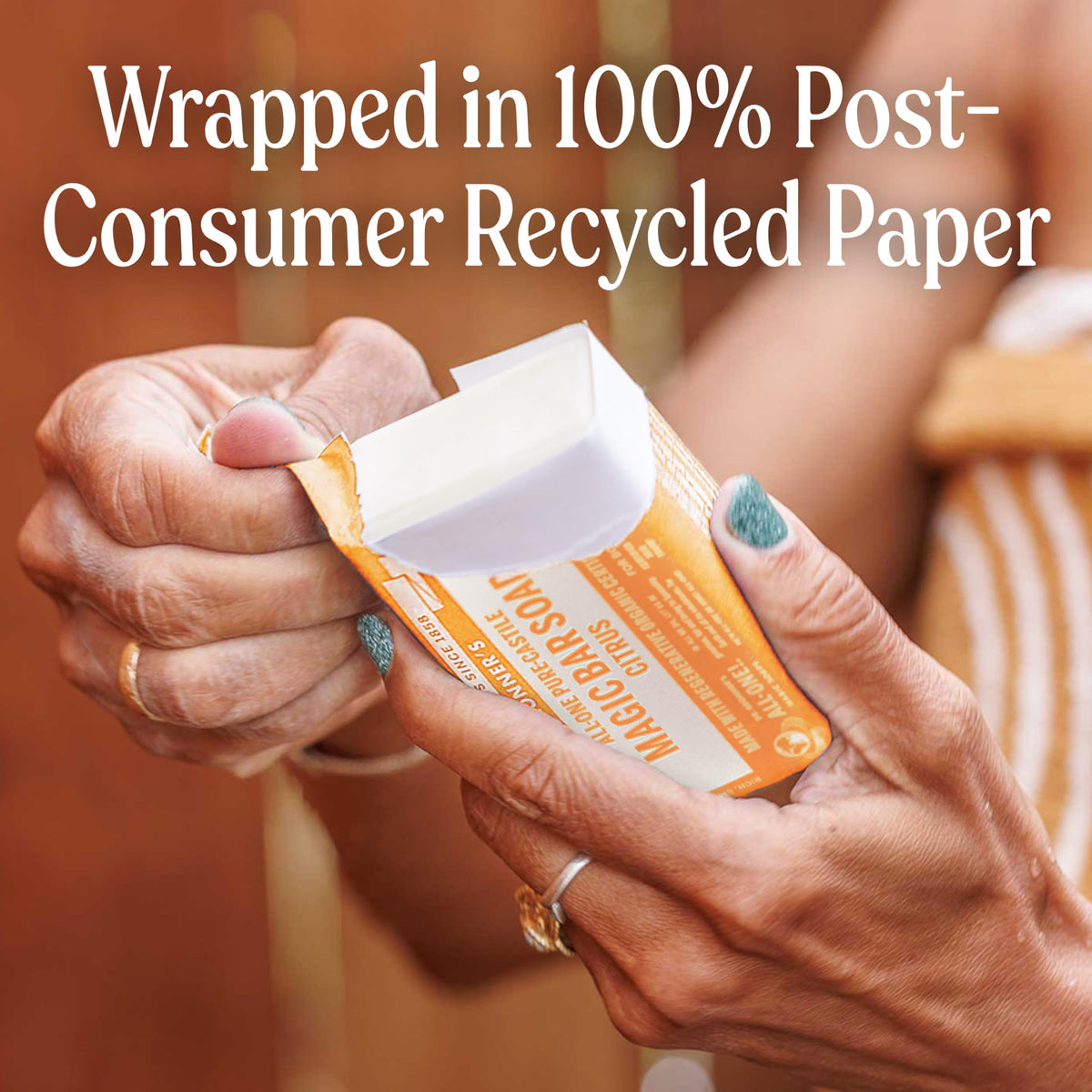 Dr. Bronner's bar wrapped in recycled paper showing reduced waste benefit