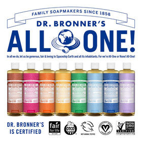 Dr. Bronner's bottles beside common items to show 8oz scale and travel convenience