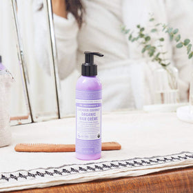 Applying Dr. Bronner's creme on hands to demonstrate easy distribution and control