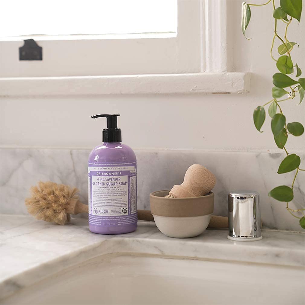 Dr. Bronner's lemongrass pouring in hand, demonstrates easy dispensing and control