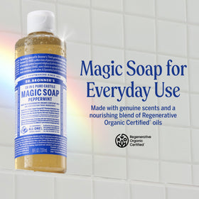 Dr. Bronner's peppermint soap pouring to show thin liquid texture and concentration