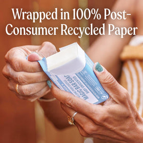 Dr. Bronner's recycled paper wrapper detail highlighting eco packaging